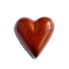 Peanut butter chocolate bonbon.  Copper colored heart shaped chocolate bonbon.  The Chocolate Palette Utah