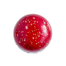 Red and gold specked chocolate bonbon. Raspberry and white chocolate bonbon.  The Chocolate Palette Utah