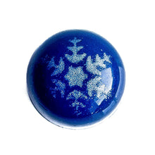Pecan Caramel chocolate bonbon.  Blue with silver snowflake.  The Chocolate Palette Salt Lake City Utah