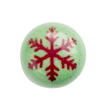 a green and red snowflake chocolate bonbon the chocolate palette utah