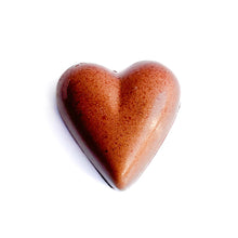 Heart-shaped chocolate on a white background Tart cherry dark chocolate bonbon The Chocolate Palette Salt lake City utah 