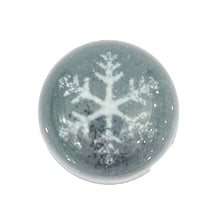 Silver chocolate bonbon with a white snowflake pattern.  60% dark chocolate ganache. The chocolate palette Salt Lake City Utah
